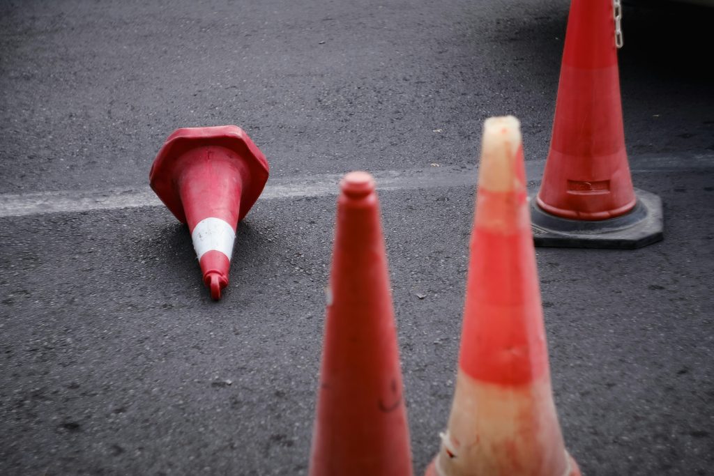 a group of orange cones on the ground